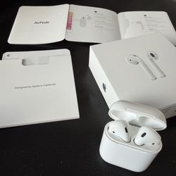 Genuine Apple AirPods 2 + Blue Silicone Case and Original Box and Manuals. Clean, Works Perfectly. Unpaired - Ready for a new user. 