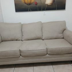 Beige Couch And Pulls Out As Bed