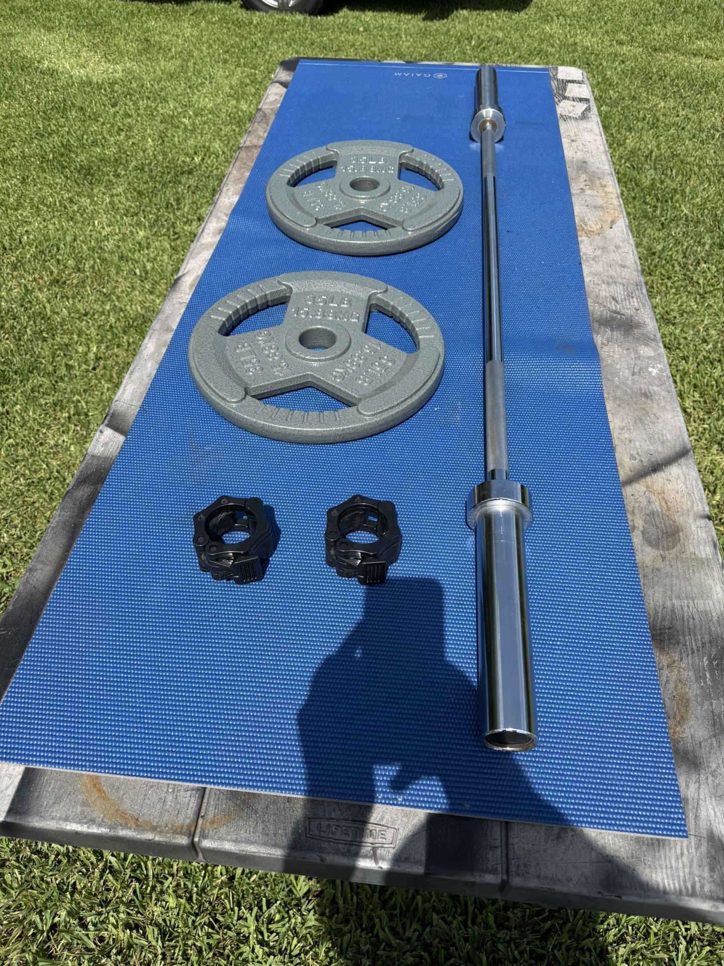 Set Including 5’ Olympic Bar And Pair Of 35 Pound Easy Grip Weights