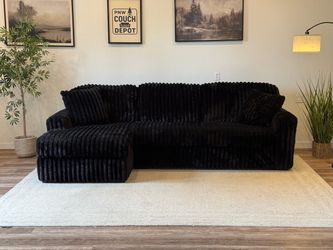 Ashley furniture black corduroy couch delivery available