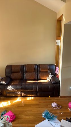Brown leather couch with pop out seats