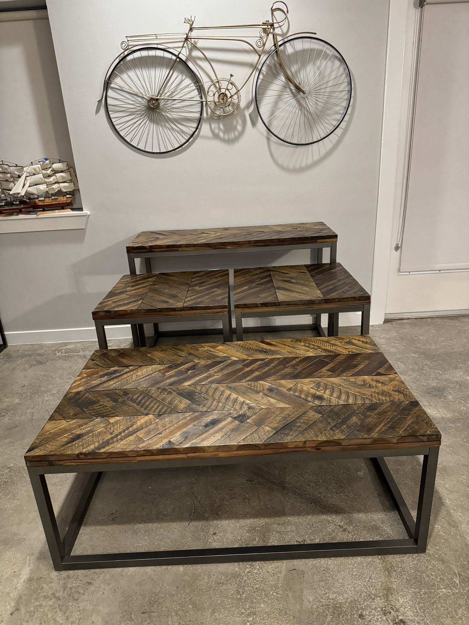 Industrial/rustic style tables set by Steve Silver 