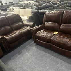 Like new Authentic Leather Power Reclining Pair Of Loveseats!