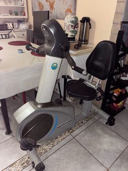 Recumbent exercising bicycle