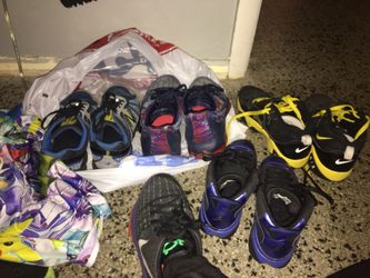 Bag full of kids stuff clothes shoes movies Games toys