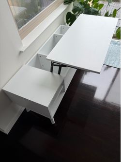 Coffee table with lifting top