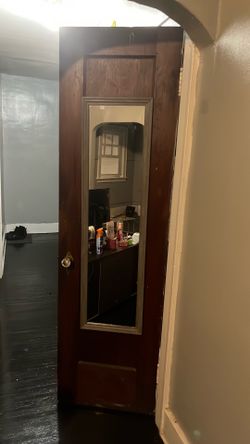 Grey mirror and two orange/red mini paintings