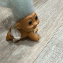 Vintage Russ Baby Troll Doll With Light Blue Hair Wearing A Diaper And A Bib