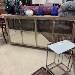 BRAND NEW Ashley Chaseton accent cabinet. It features a light wood finish with mirrored door fronts and chrome-tone pulls - 79” x 20” x 39” - Retail: 