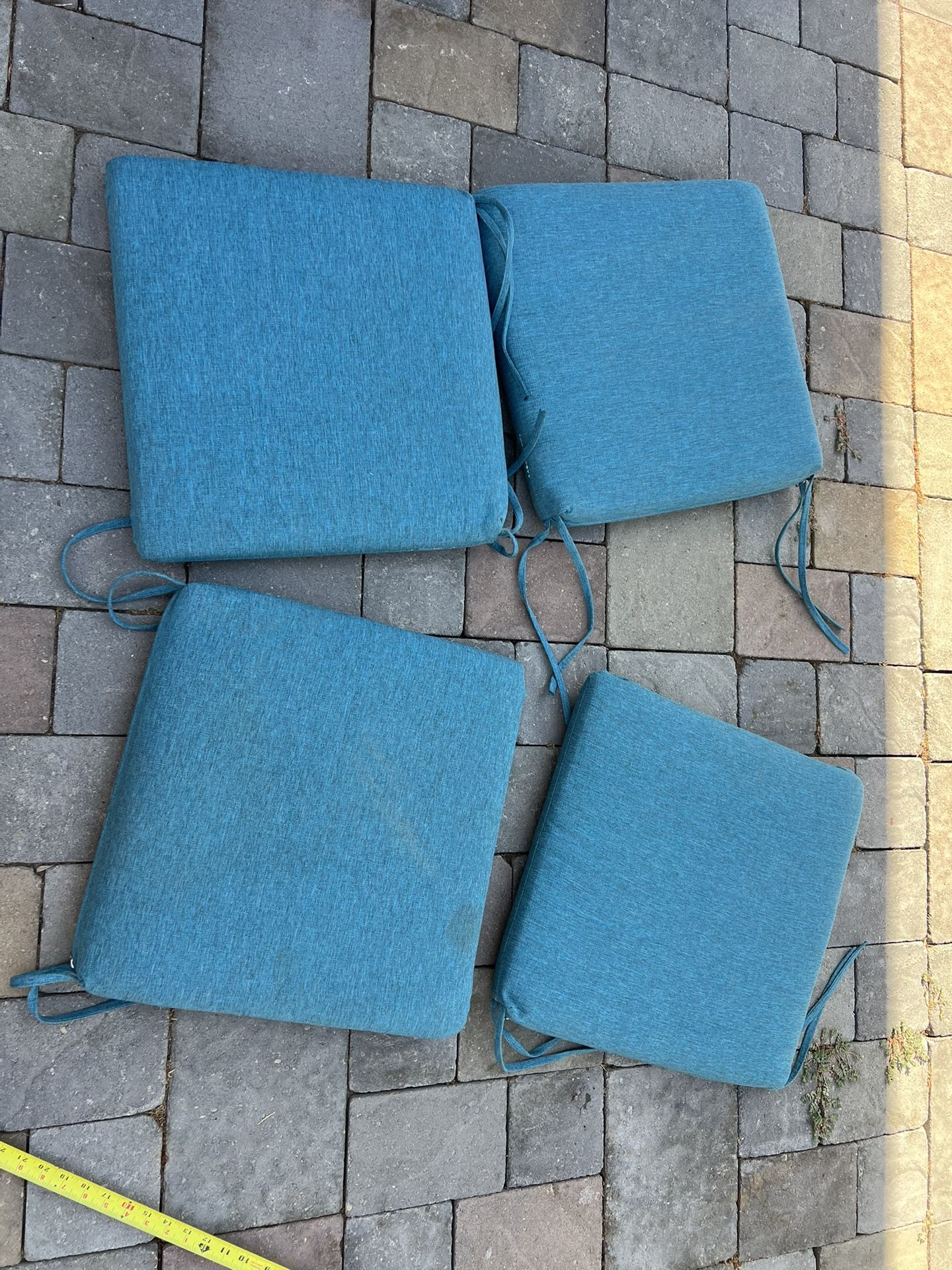 4 Piece Outdoor Patio Furniture Cushions in Teal Blue   Located in concord  Very good condition  No damages Covers not removable   Measures 18” x 18” 