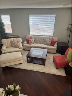 Tufted Sofa, Oversized Armchair, and Ottoman Set with glass coffee table, and end tables.