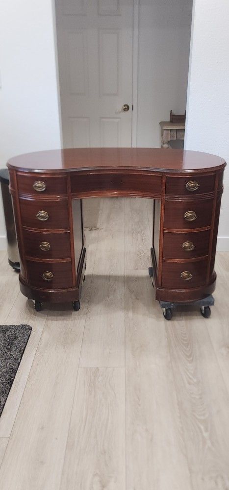Antique mahogany kidney shaped 8 drawer desk