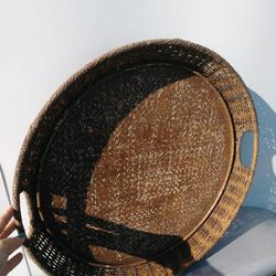 Beautiful wicker/ratton serving tray. Round