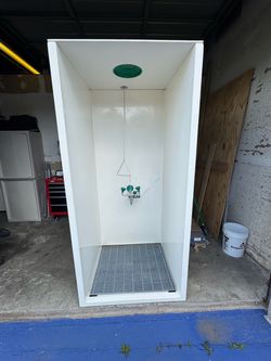 Eye wash and safety shower enclosure