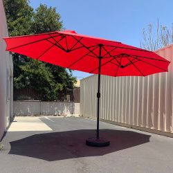 $130 (New) Large 15ft double sided outdoor umbrella w/ 65 lbs plastic weight base (red/gray)