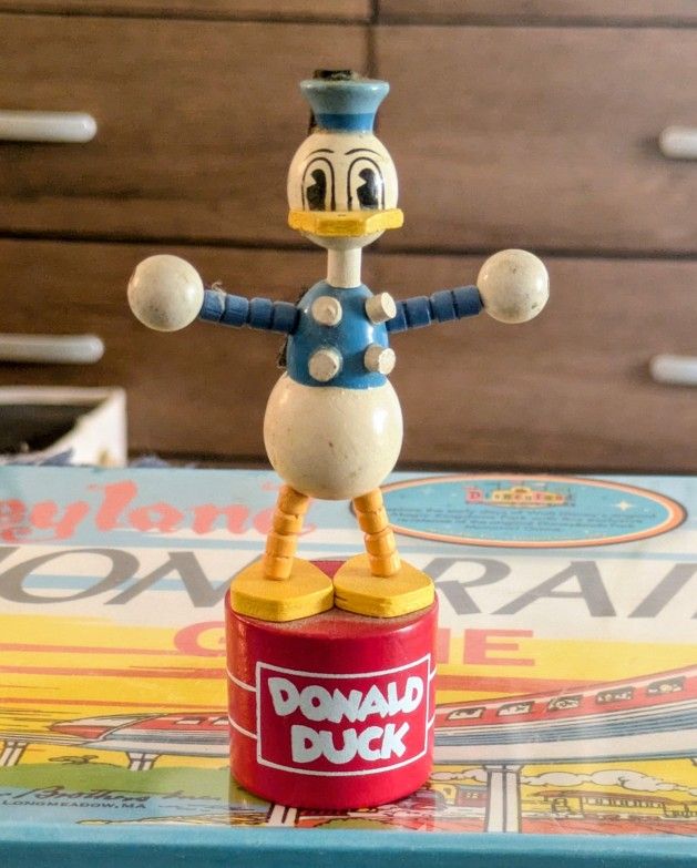 This is an extremely rare vintage figurine of Donald Duck, a beloved character from the Disney franchise. It is a highly sought-after collectible 