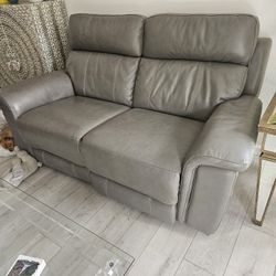 Reclining Sofa And Love Seat, Leather With 4 Seats that recline electrically.