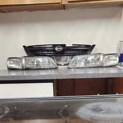 Nissan Front Grille and Headlight Assembly Set From.a Nissan Maxima GLE 1998