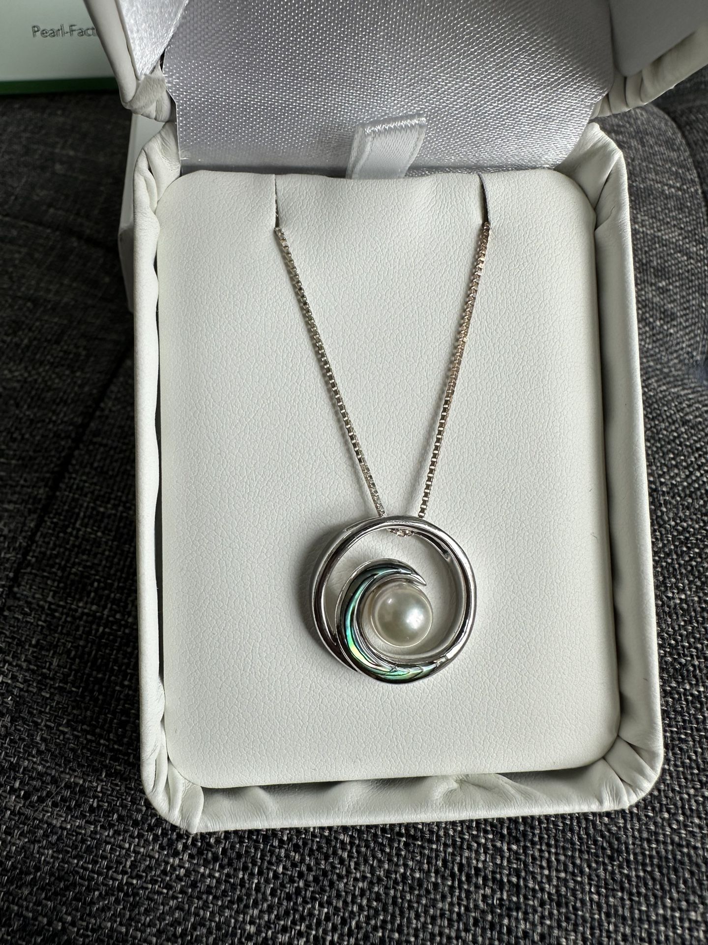 Na Hoku Pearl Factory silver wave pendant with abalone and creamy white Akoya pearl and adjustable silver chain.