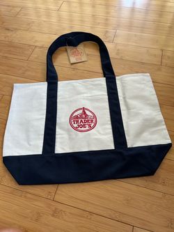 Trader Joe’s classic large tote bag in navy blue color with tag