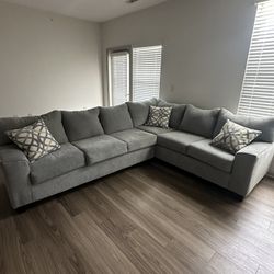 Modern Light Gray Sectional Sofa – L-Shaped with Accent Pillows  
