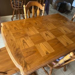 Oak dining table and four chairs