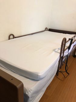 Electric hospital adjustable bed with mattress.