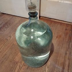 One glass five gallon Eagle Spring Water bottle with fermentation cap