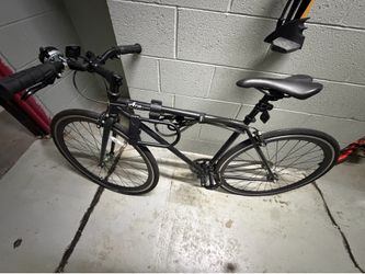 Pair of Adult Bicycles: Black Hybrid & White Hybrid/Road Bike