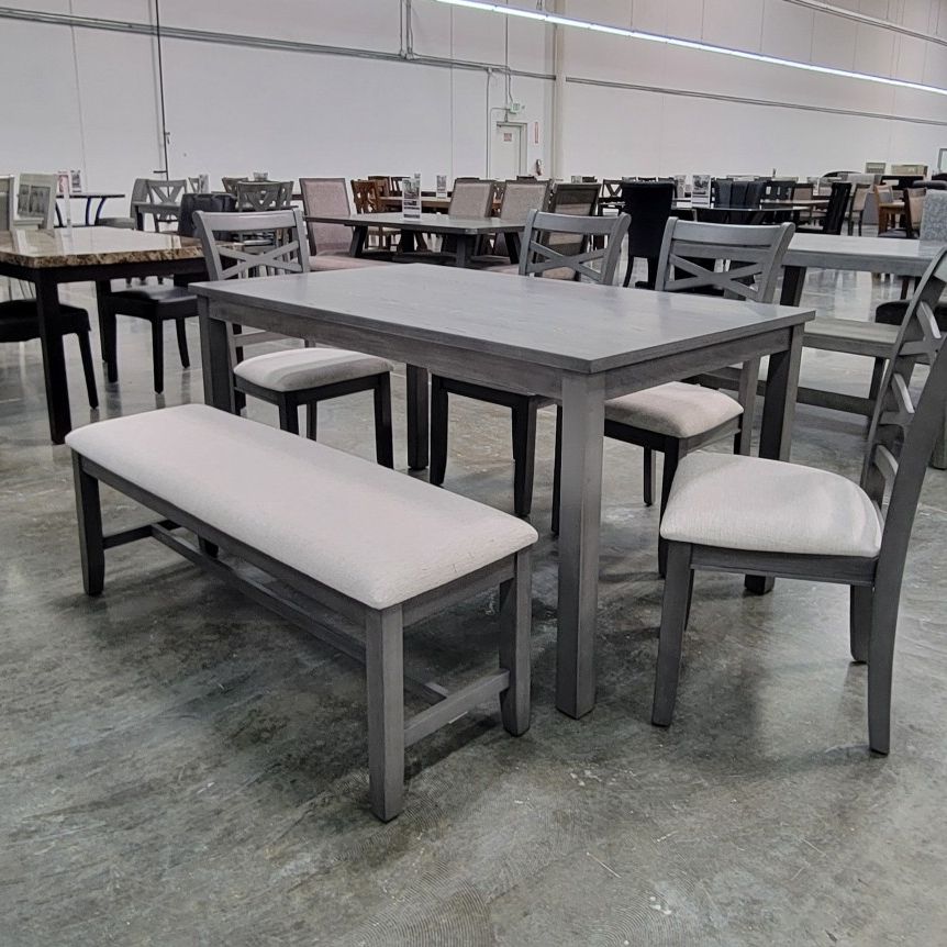 6 pc  ligght grey finish wood dining table set padded seat chairs and bench. This set includes the table and 4 side chairs padded seats and a bench. T