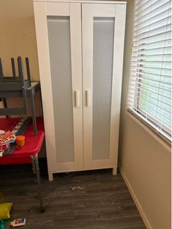 White wardrobe with frosted panel doors