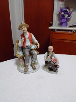 Porcelain Figurines Set of Two Old Men. One 9"Tall and one 5"Tall