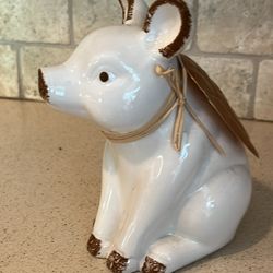 cute piggy statue with wings