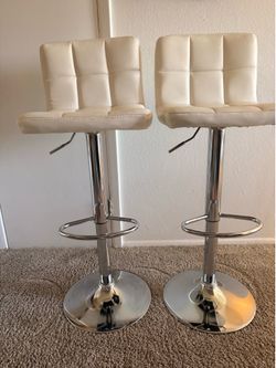 Matching pair of swivel bar stools