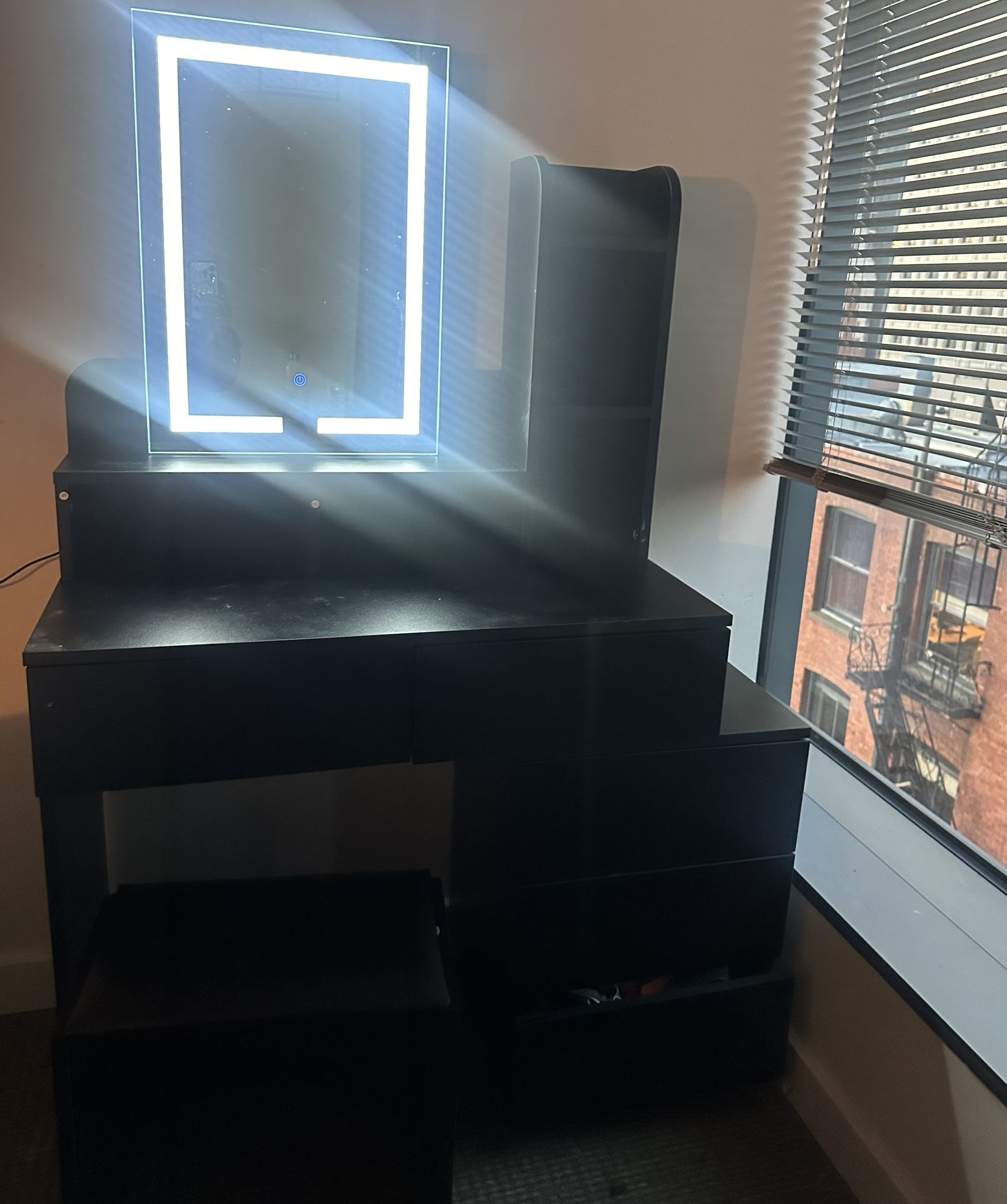 Vanity table with mirror and a seat