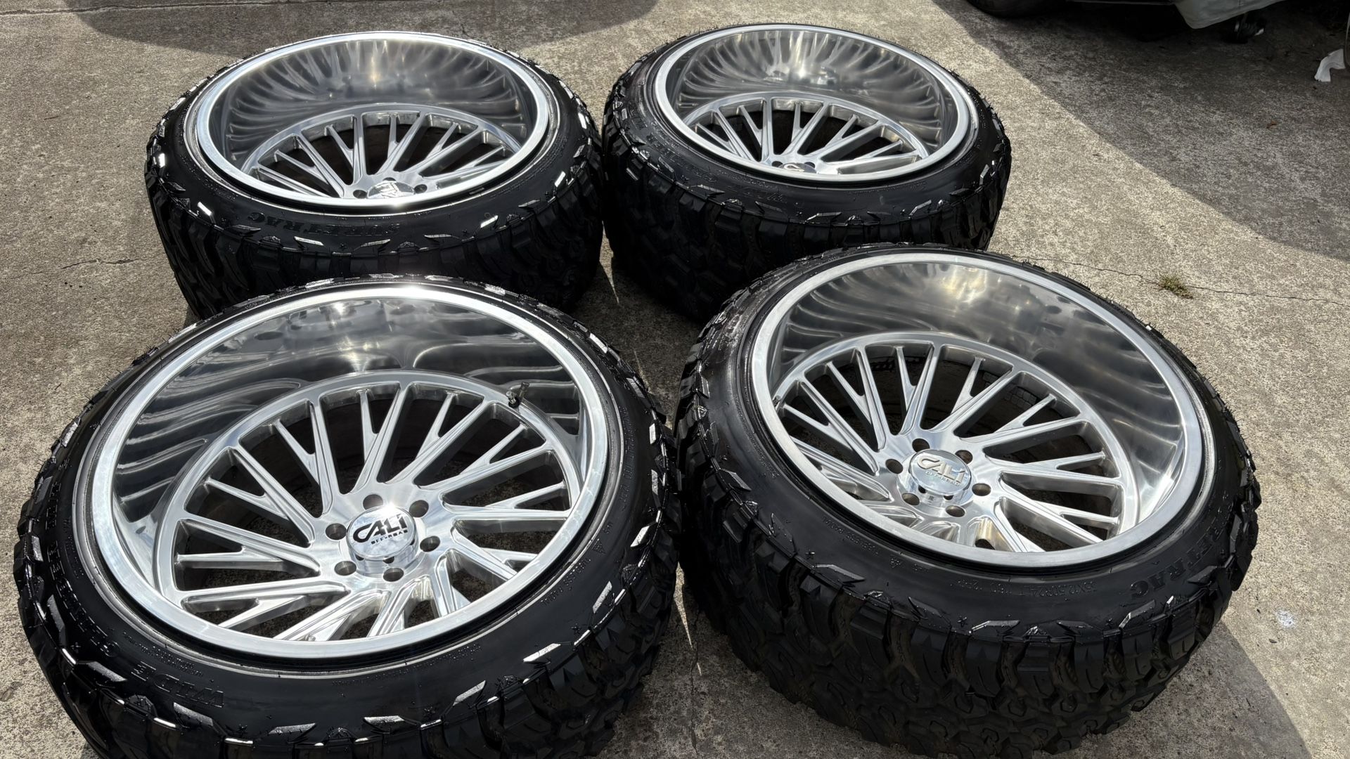 24x14 POLISHED CALI DEEP DISH RIMS AND NEW TIRES . 6 lug
