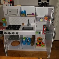 Realistic play kitchen with accessories