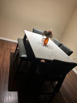 Dining table with 4 chairs and a bench