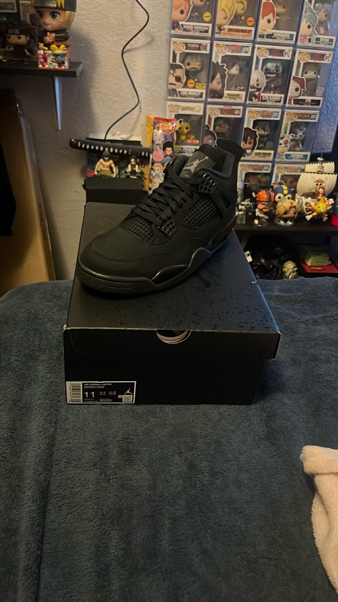 Black Cat Jordan 4’s