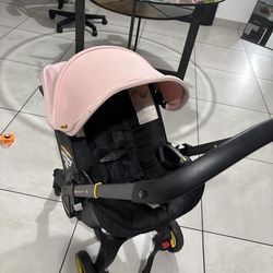 Pink Doona Stroller  2 in 1 system (car seat + stroller)