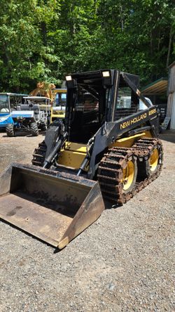 1999 New holland LX565 diesel skid steer tracks over wheels