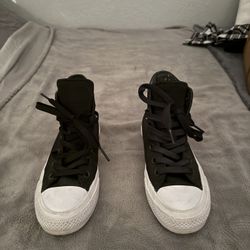 Black and white Converse trainers