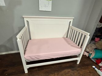 White wooden convertible crib