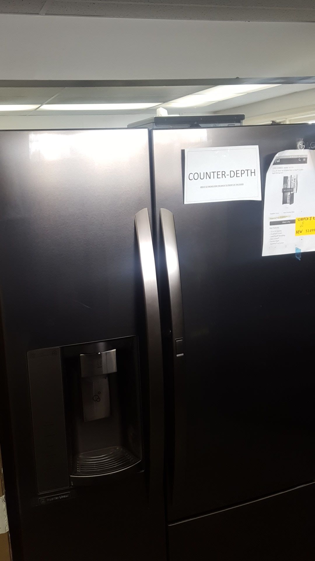 LG scratch and dent black stainless refrigerator side by side