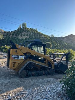 Land clearance skid steer mulcher