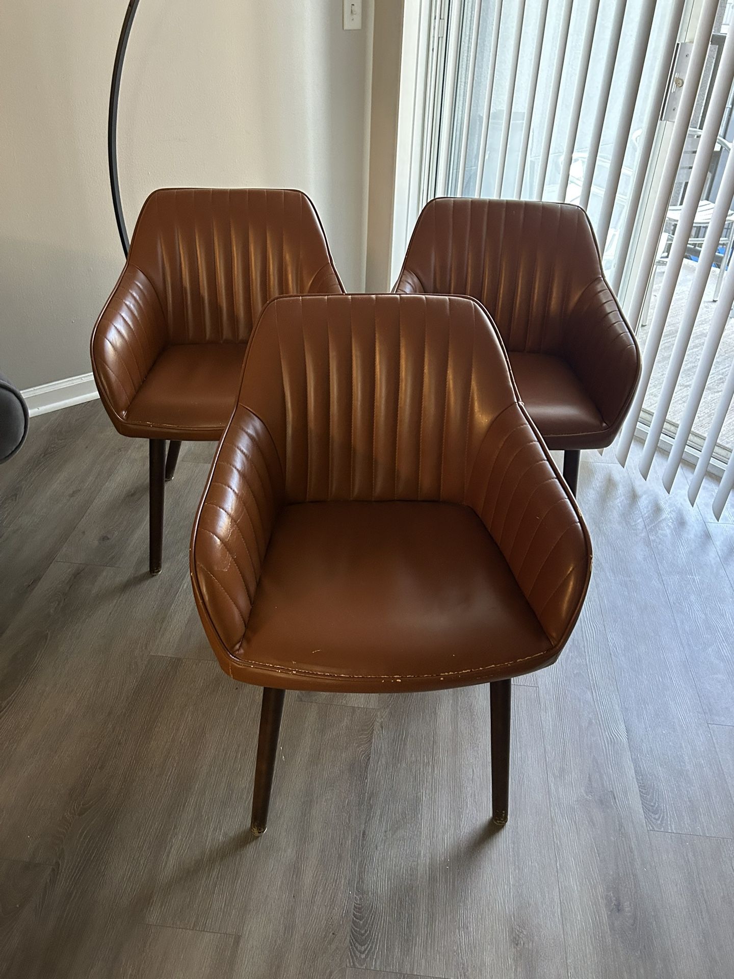 A Set Of Three Retro Brown Leather Vintage Chairs