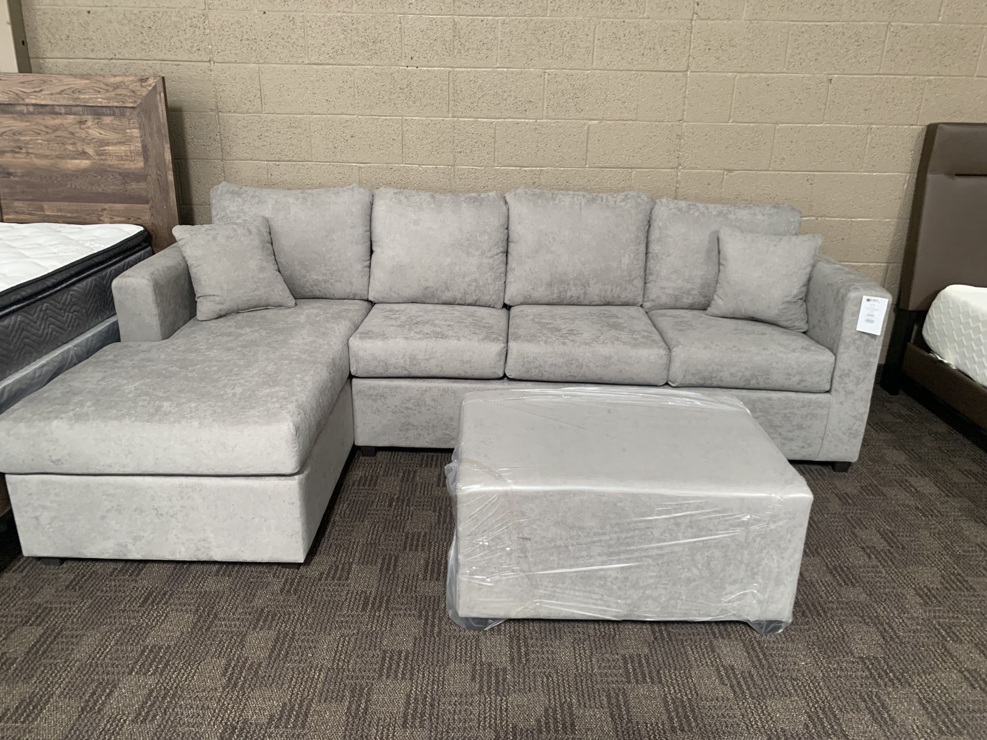 New Grey Sectional And Ottoman