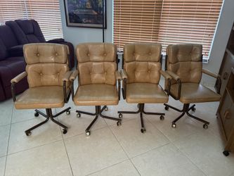 Set of 4 Stoneville Swivel Caster Dining Chairs – Tan Tufted, Bronze Frames, Wheels
