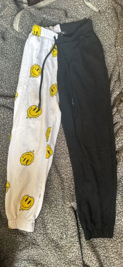 half smiley face half black sweatpants 