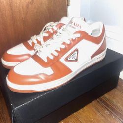 Prada Downtown Leather Sneakers in White and Orange. 